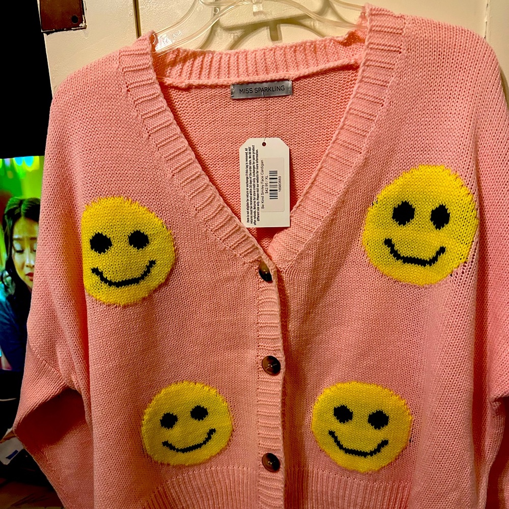 Pink smiley face sweater